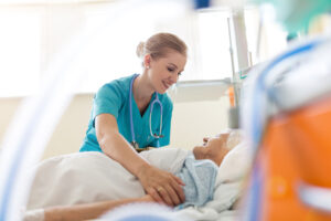 Nurse Caring For Hospital Patient