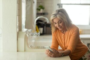 Woman Researching Medicare On Phone