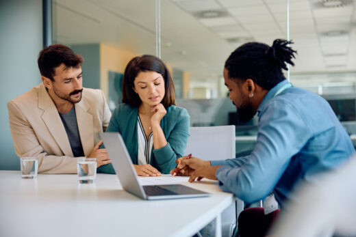 Mid adult couple having consultations with their agent in the office.