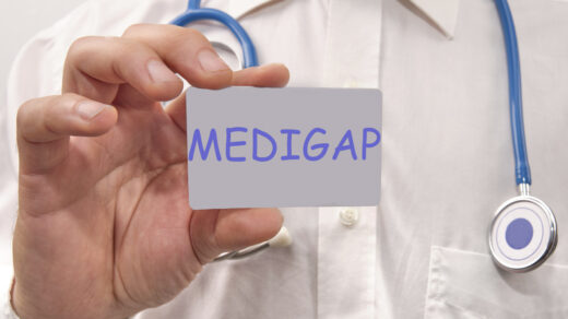 Doctor holding a card labeled Medigap, representing High Deductible Plan G Medicare Supplement coverage.