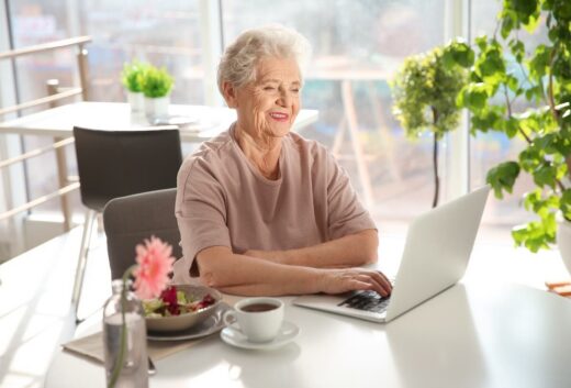 Elderly Woman Researching Medicare at 65